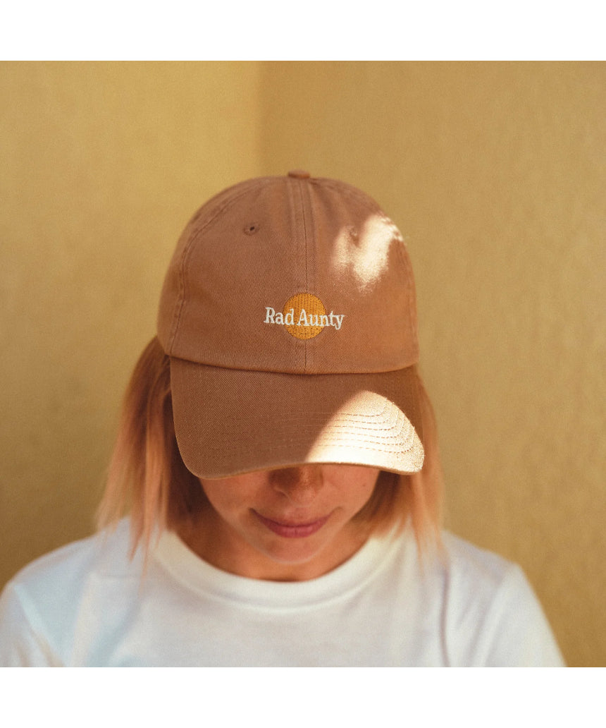 Banabae Rad Aunty Washed Baseball Cap in desert sand, showing its casual washed look and adjustable strap.