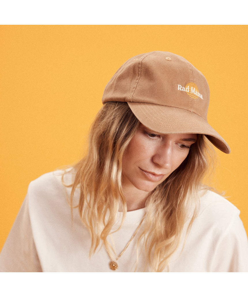 Banabae Rad Mama washed baseball cap in desert sand, showing a casual, curved brim and adjustable strap for a relaxed fit.