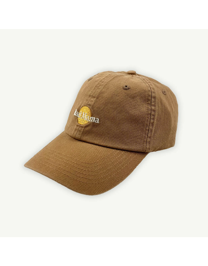 Banabae Rad Mama washed baseball cap in desert sand, showing a casual, distressed style with a curved brim and adjustable strap.