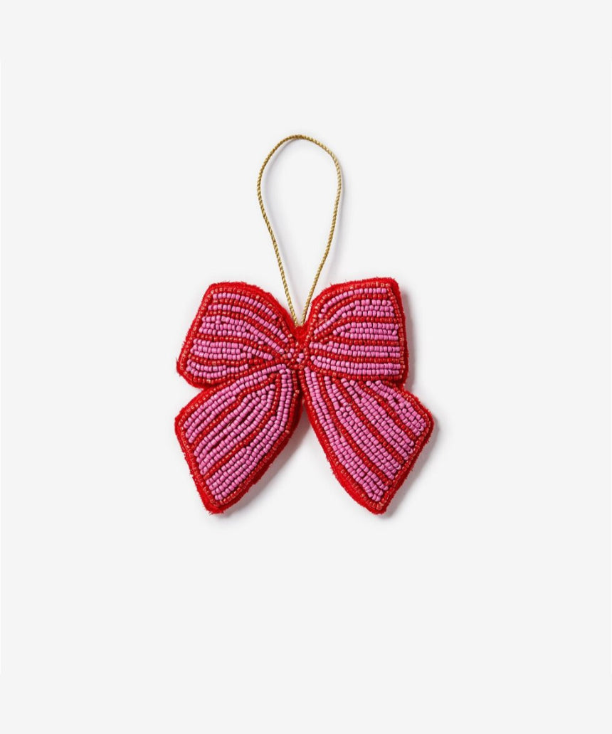 Pink beaded bow Christmas decoration by Bonnie and Neil, festive holiday ornament with intricate beadwork and soft pink color.