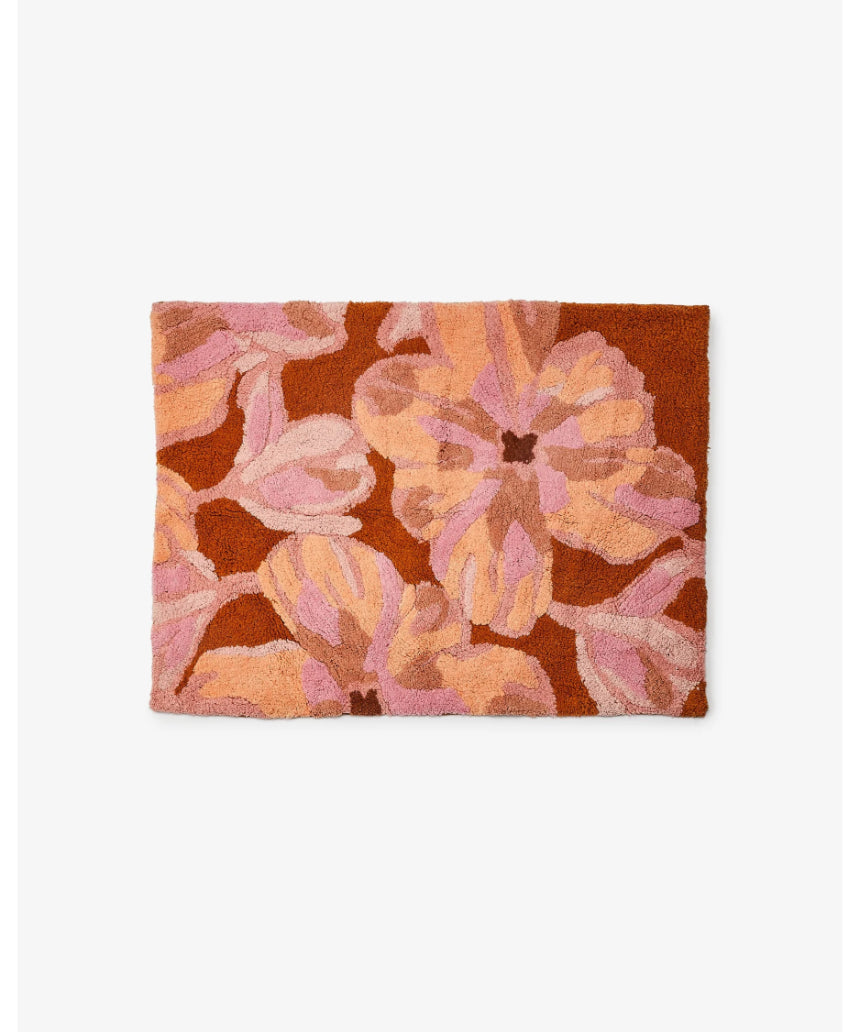 Pink Dutch floral Bonnie and Neil bath mat with a decorative floral pattern, ideal for bathroom decor.