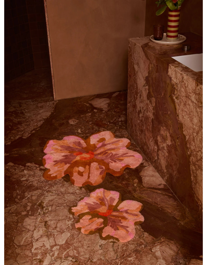 Bonnie and Neil Mini Tulip Tan bath mat with a soft, textured surface, styled in a bathroom setting.