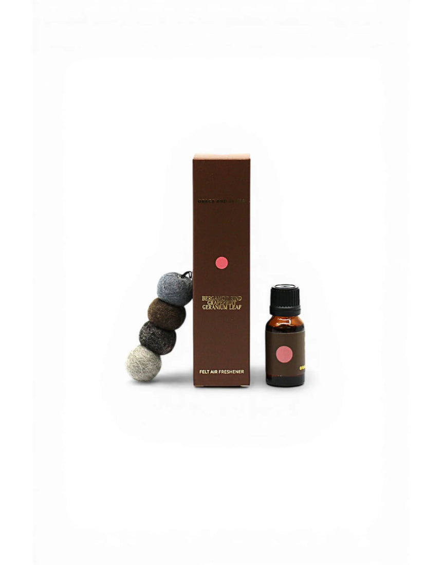 Grace & James Forager air freshener featuring bergamot rind, grapefruit, and geranium in a sleek bottle.