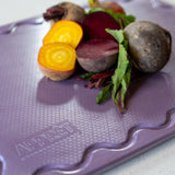 Maison Apprêt petite lilac chopping board with smooth surface and rounded edges, perfect for kitchen prep and serving.