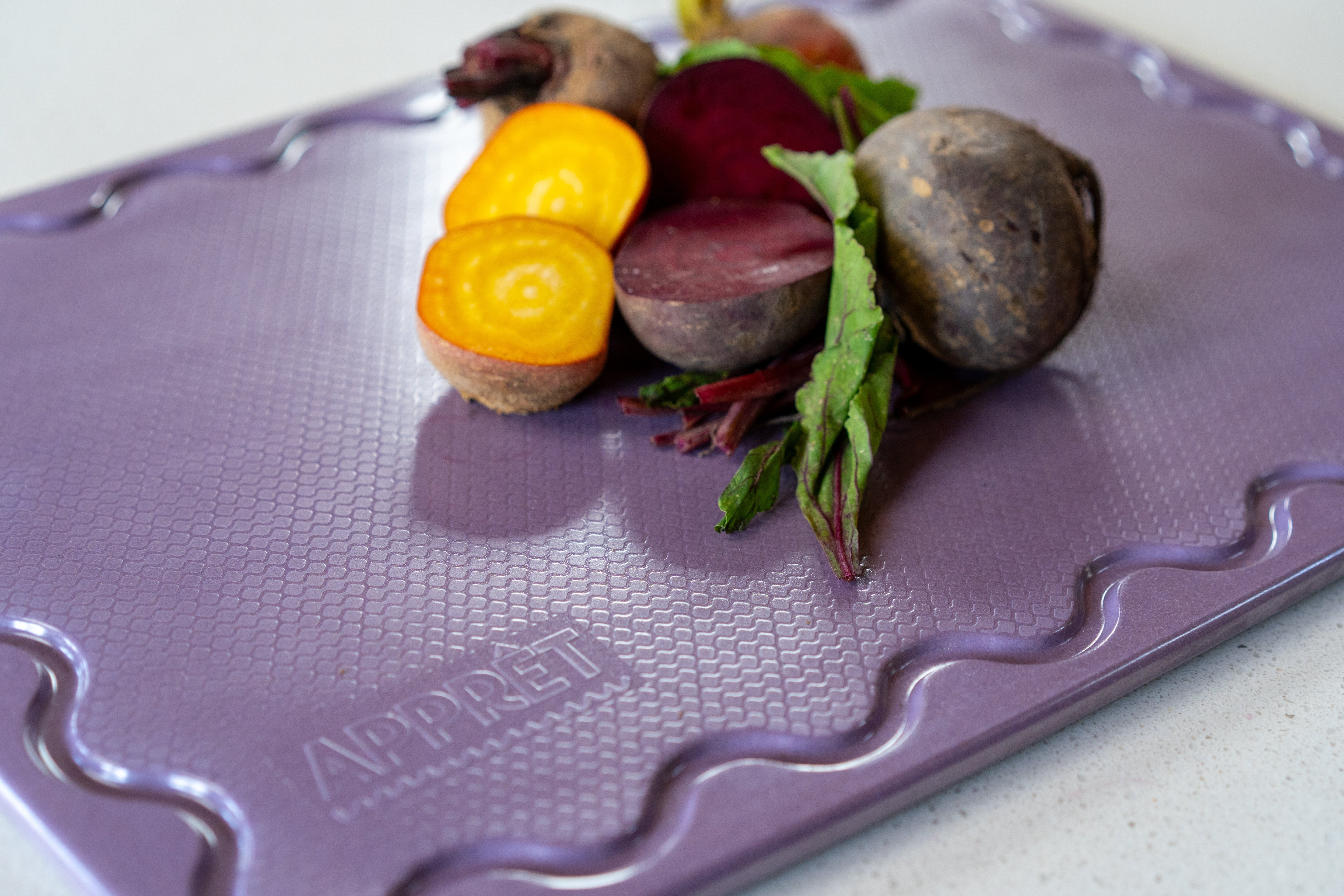 Maison Apprêt petite lilac chopping board with smooth surface and rounded edges, perfect for kitchen prep and serving.