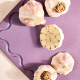 Maison Apprêt petite lilac chopping board with smooth surface and rounded edges, ideal for kitchen prep.