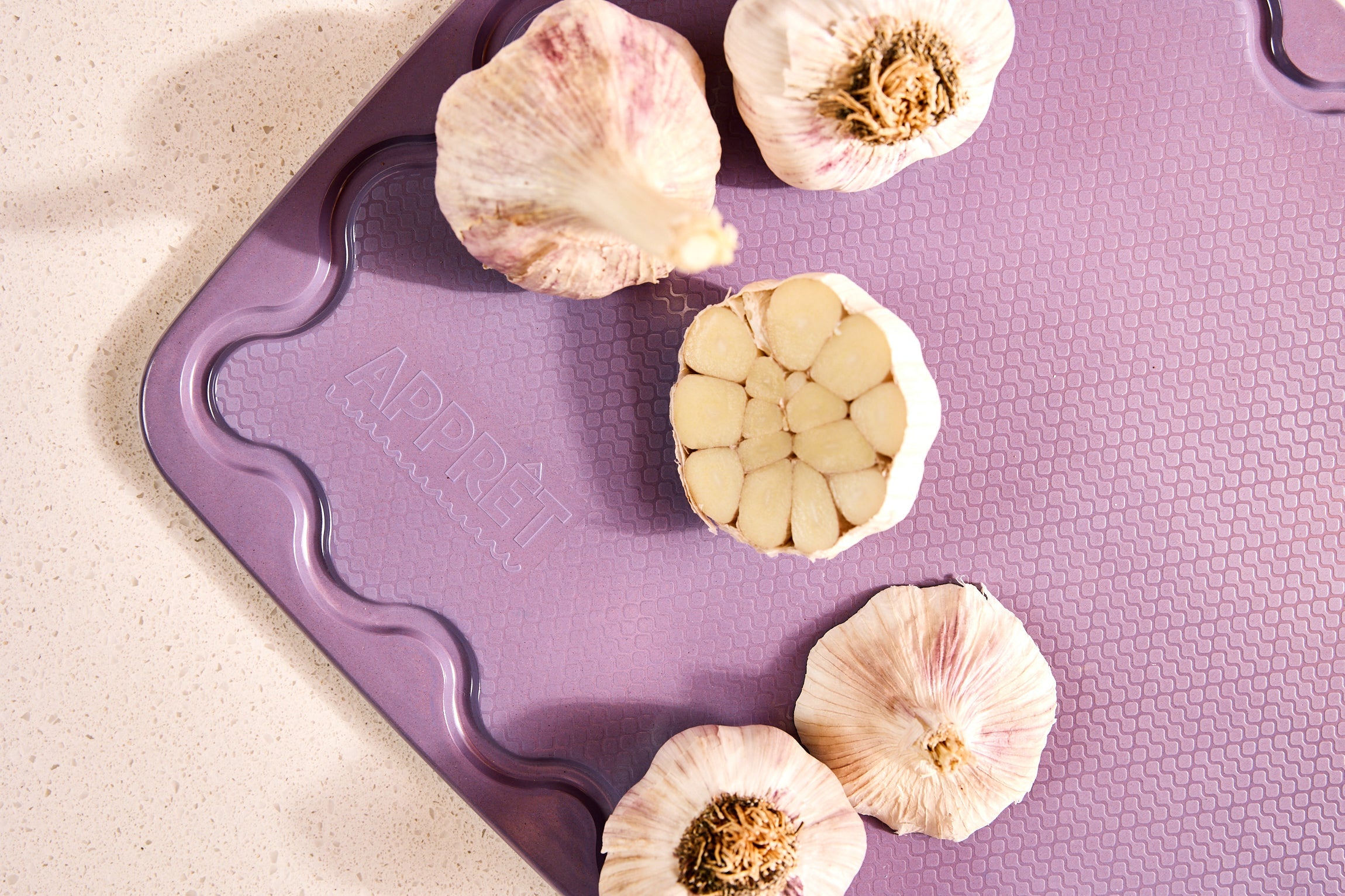 Maison Apprêt petite lilac chopping board with smooth surface and rounded edges, ideal for kitchen prep.