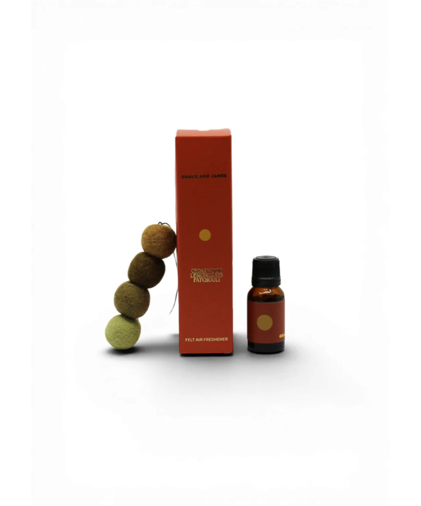 Grace and James cedarwood, lemongrass, and patchouli air freshener bottle with natural scent ingredients.