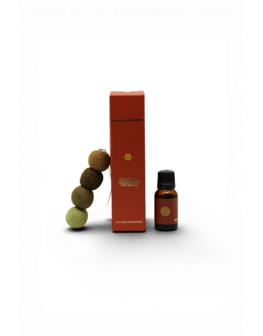 Grace and James cedarwood, lemongrass, and patchouli air freshener bottle with natural scent ingredients.