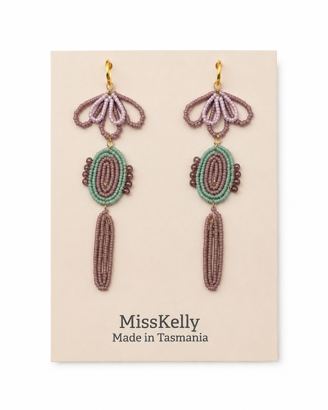 Miss Kelly Madison statement earrings featuring bold, modern design with gold-tone accents and intricate detailing.