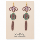 Miss Kelly Madison statement earrings featuring bold, modern design with gold-tone accents and intricate detailing.