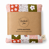 Handmade Jems Botanics Lupin heat pack featuring a soft fabric cover with floral botanical patterns and a cozy filling.