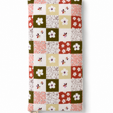 Handmade Jems Botanics Lupin heat pack with floral fabric cover and tied ribbon, designed for soothing warmth and comfort.