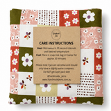 Handmade Jems Botanics Lupin heat pack showing a soft, fabric-covered lavender-colored heat pack for soothing warmth.