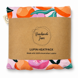 Pink peach lupin-shaped handmade heat pack by Handmade Jems, soft fabric with floral design for warmth and comfort.