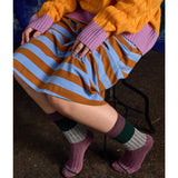 Close-up of Tightology chunky rib Merino wool socks in mauve, showing thick knit texture and cozy design.