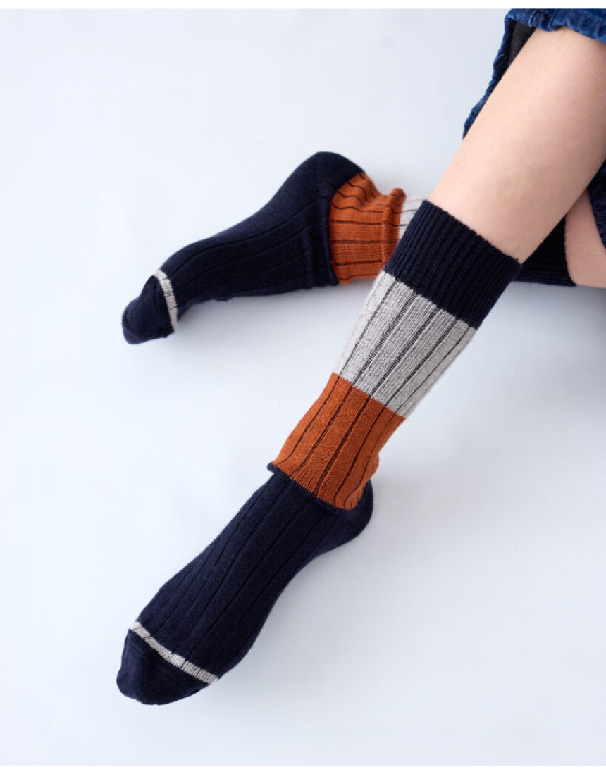 Tightology chunky rib Merino wool socks in midnight color, featuring thick knit texture and cozy, warm design for cold weather.