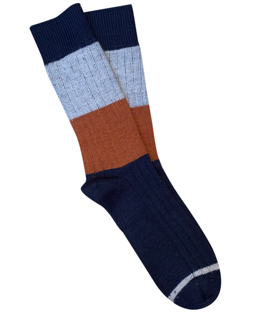 Tightology Chunky Rib Merino Wool Socks in midnight blue, featuring thick ribbed knitting and cozy, warm wool fabric.