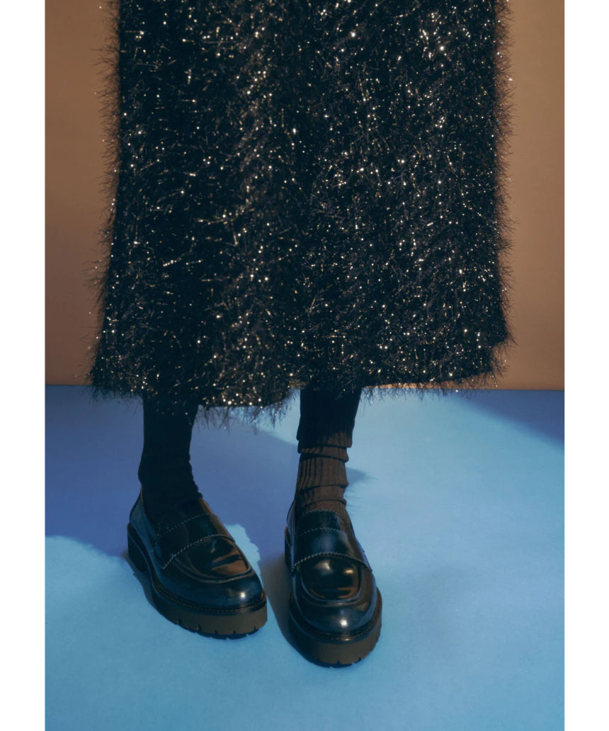 Elk Ilta skirt in a stylish design, featuring a flowing silhouette and detailed fabric, perfect for versatile fashion looks.