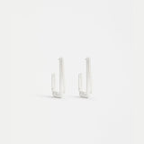 Silver Sokar earrings by Elk featuring sleek, modern design with polished silver finish and intricate detailing.