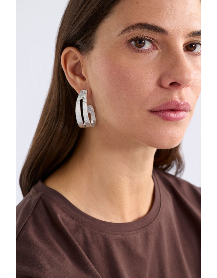 Silver Amner large hoop earring by ELK The Label, showcasing a sleek, polished hoop design with a modern, minimalist style.