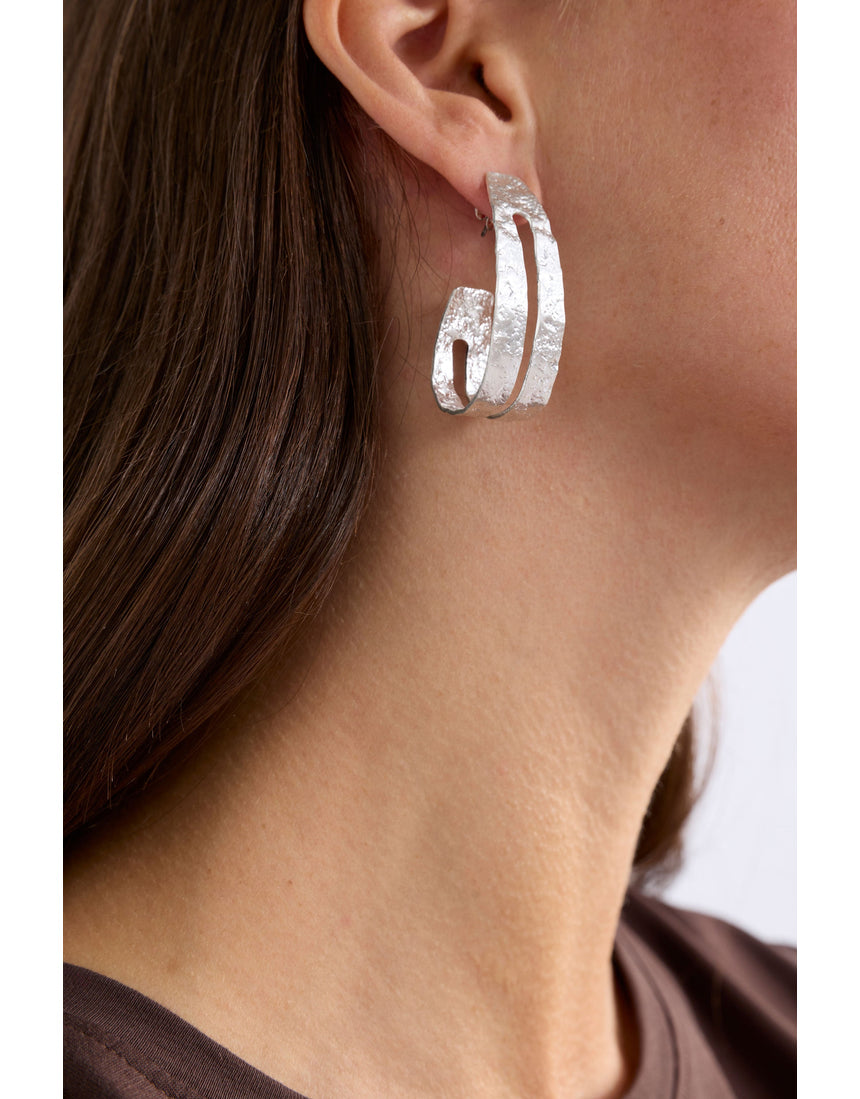 Silver Elk Amner large hoop earring from ELK The Label, featuring smooth, rounded silver hoops with a modern design.