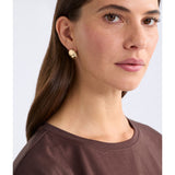 Gold Elk Atur Mini Stud Earrings from ELK The Label, featuring small, simple gold stud designs with a polished finish.