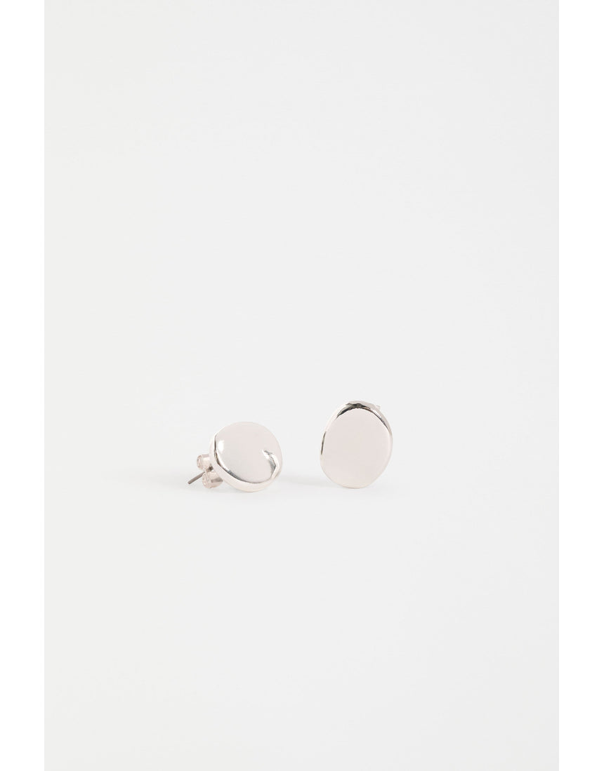 Silver Elk Atur Mini Stud Earrings from ELK The Label featuring small, sleek silver earrings on a plain background.