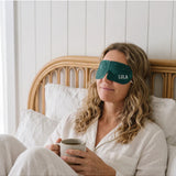 Lula self-warming eucalyptus and tea tree eye mask showing soft fabric and adjustable strap for relaxation and soothing relief.