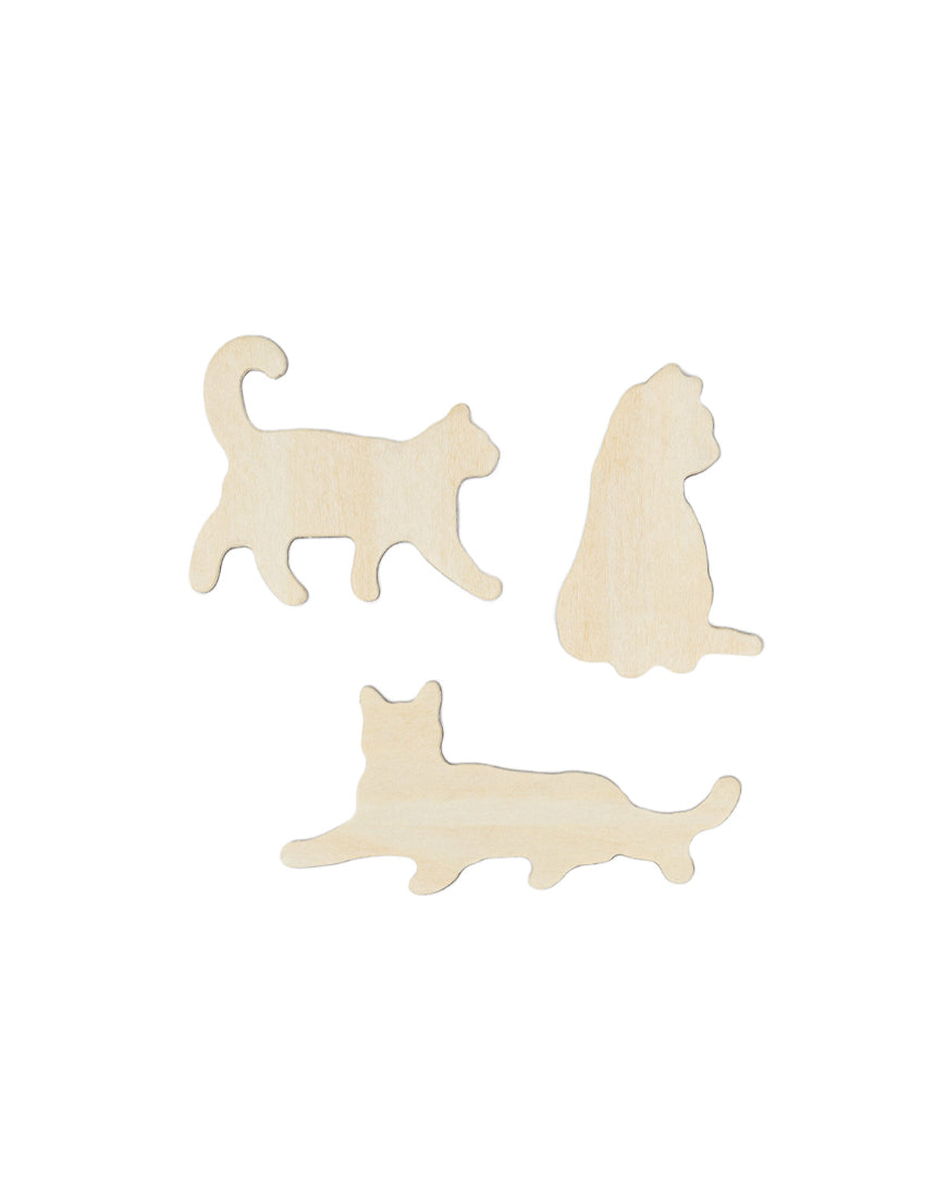 Set of Suck UK fridge magnets featuring colorful, playful cat designs, perfect for decorating and organizing your kitchen.