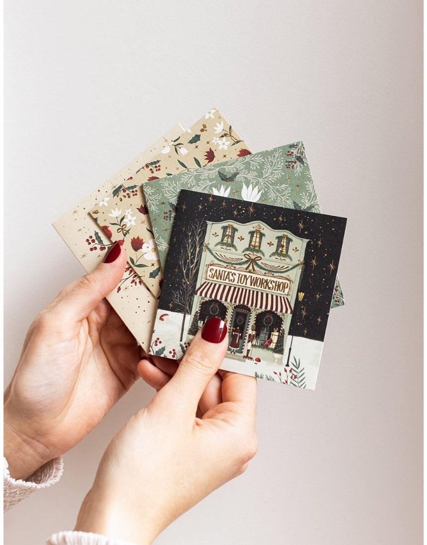 Bespoke Letterpress Christmas Village 12-pack square greeting card box set with festive holiday designs and elegant lettering.
