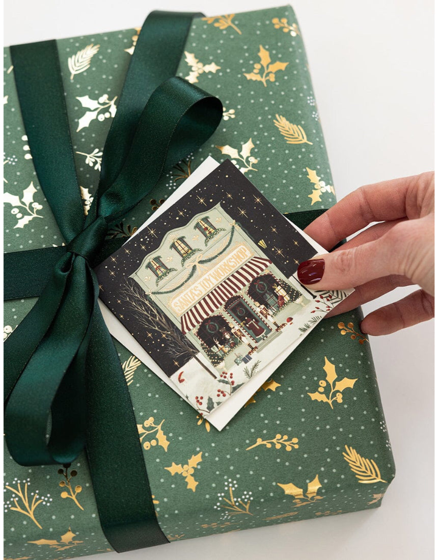 Set of 12 Christmas Village letterpress greeting cards in a square box, featuring festive holiday illustrations by Bespoke Letterpress.
