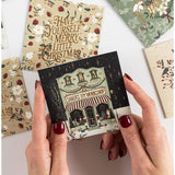 Bespoke Letterpress Christmas Village 12-pack square greeting card boxset with festive holiday village design on high-quality note cards.