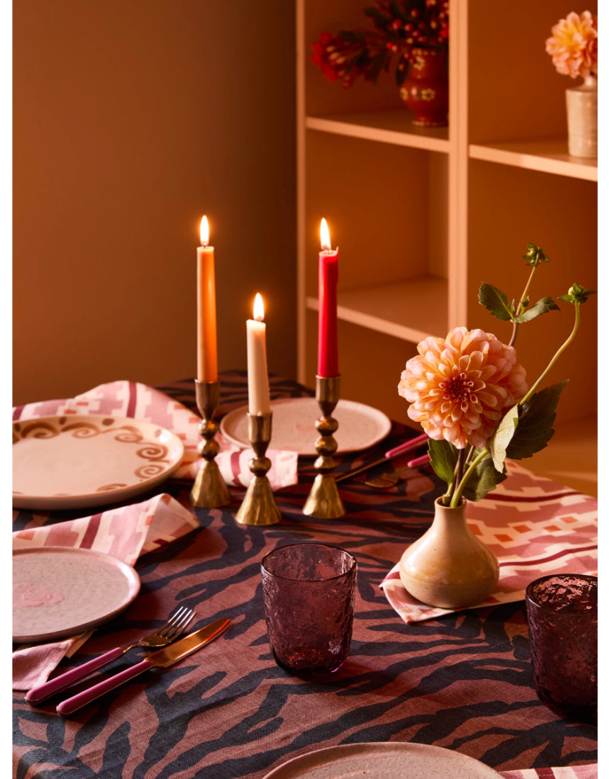 Bonnie and Neil Gem Smoke glass tumbler with a sleek, smoky design, placed on a dining table with elegant decor.