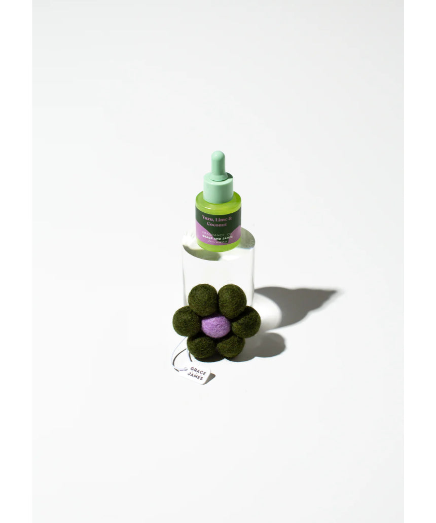 Grace & James Yuzu, Lime & Coconut felt air freshener hanging with colorful design and natural scent theme.