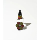 Orange and pistachio felt air freshener by Grace & James, featuring a vibrant orange and green design with a textured felt surface.