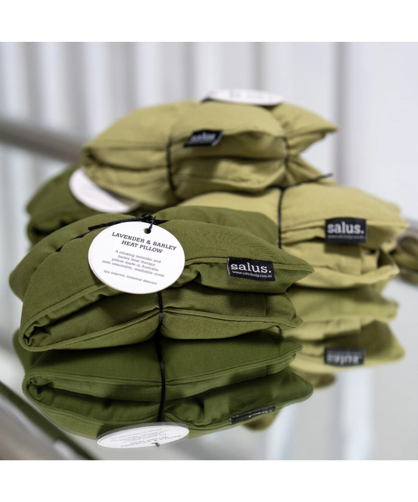 Salus Lavender & Barley heat pillow in forest green square shape, designed for soothing bath and body relaxation.