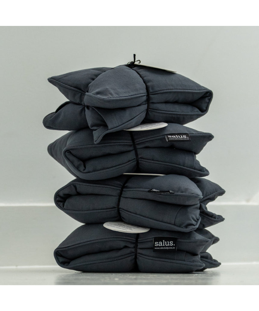 Salus lavender and barley heat pillow in charcoal, soft square shape for relaxing bath and body use.