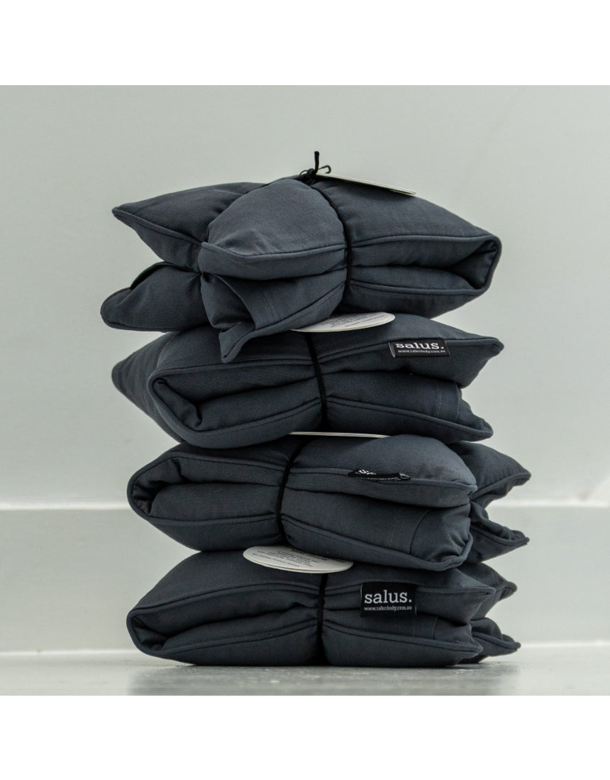 Salus lavender and barley heat pillow in charcoal, soft square shape for relaxing bath and body use.