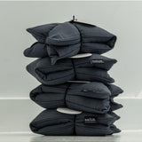 Salus lavender and barley heat pillow in charcoal, soft square shape for relaxing bath and body use.
