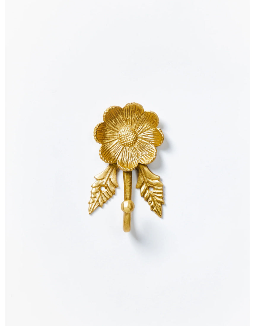 Brass Daisy Wall Hook by Bonnie and Neil, featuring a floral daisy design, mounted on a wall for decorative hanging.