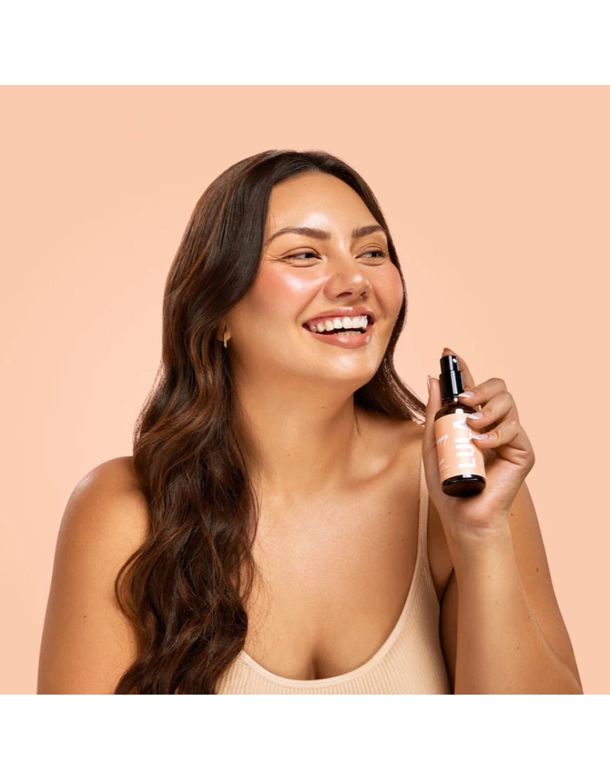 Lula Happy Mist essential oil bottle with a sleek design, featuring vibrant labels and a spray nozzle for aromatic use.