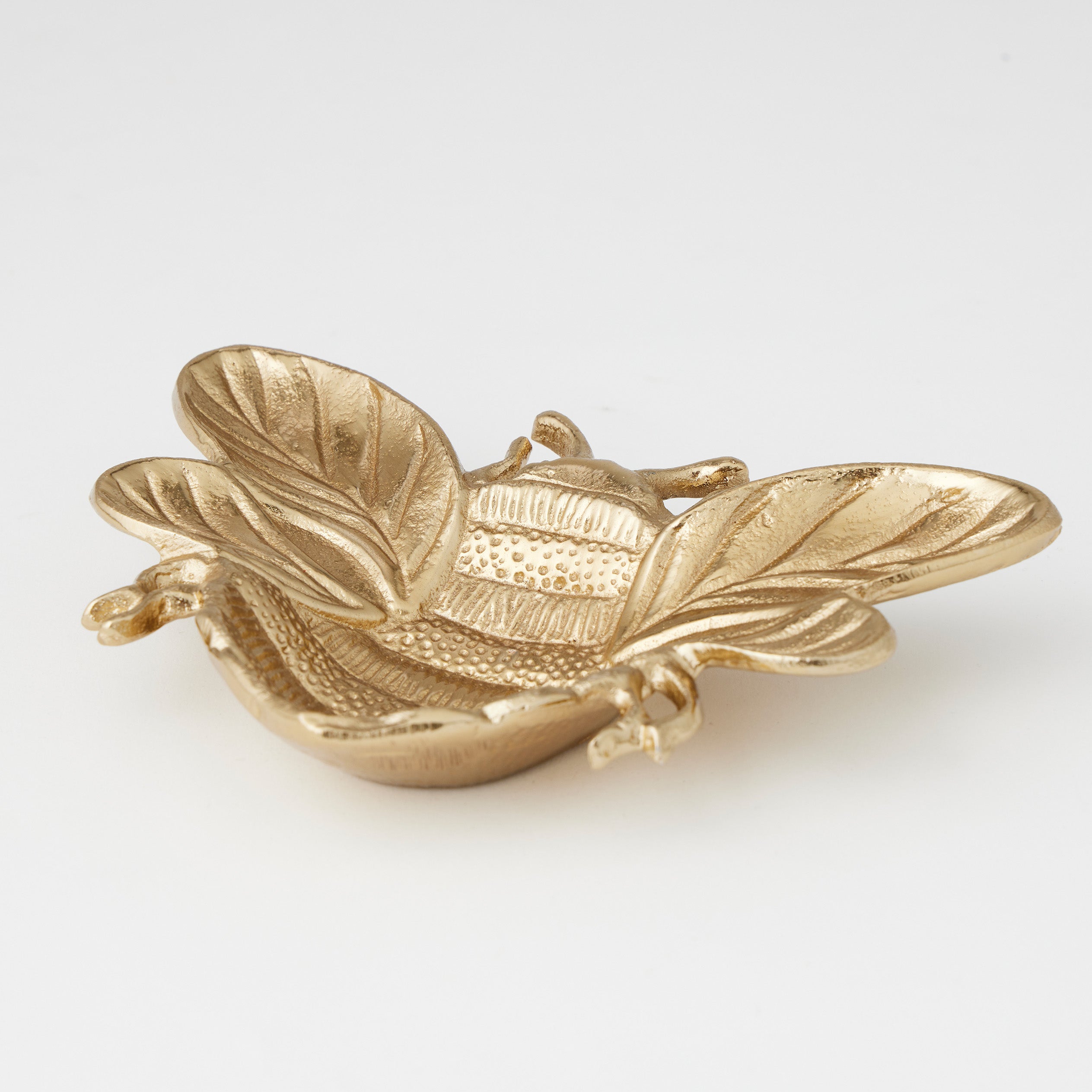 Pilbeam Living Bea shallow decorative bowl in gold with a sleek, modern design, perfect for stylish home decor.