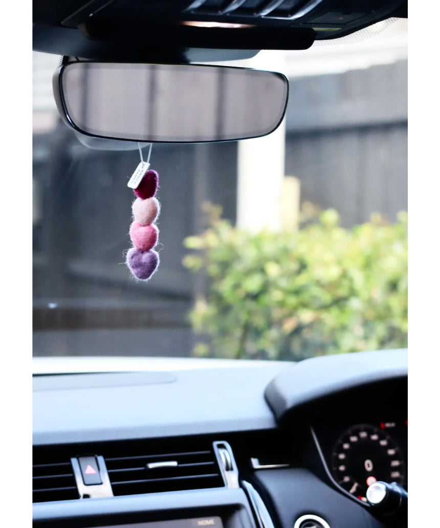 Grace & James Watermelon & Mint heart felt air freshener hanging with vibrant red and green colors and a soft felt texture.