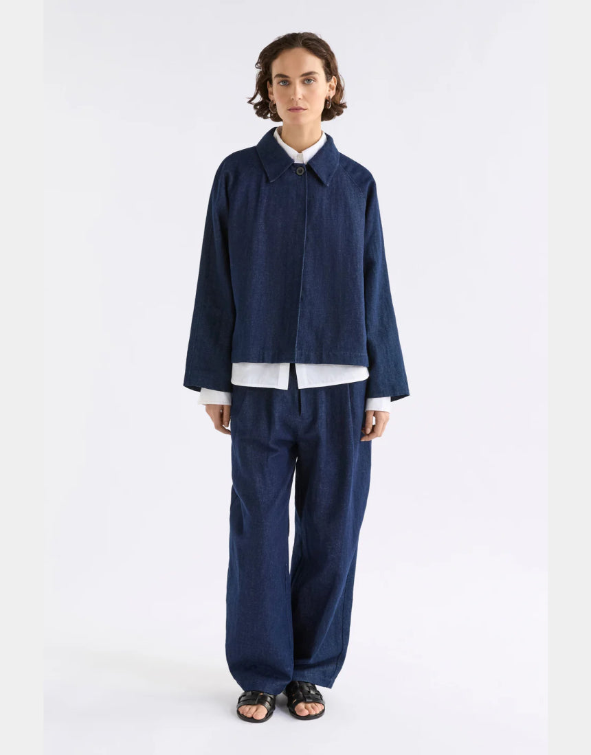 Dark blue Elk Decla Jean clothing with classic fit and stitching, shown on a hanger against a neutral background.