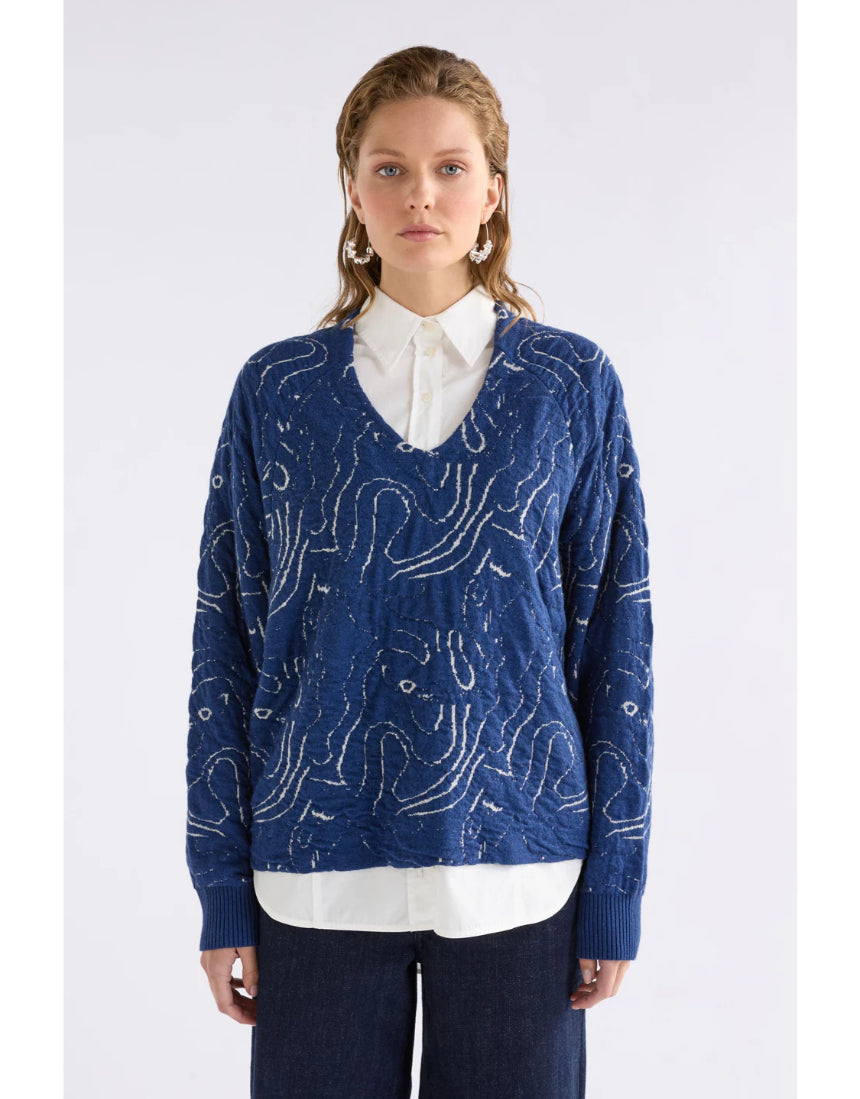Blue and silver Elk Otillia Sweater shown on a model, featuring a cozy knit design with a relaxed fit.