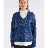 Blue and silver Elk Otillia Sweater shown on a model, featuring a cozy knit design with a relaxed fit.