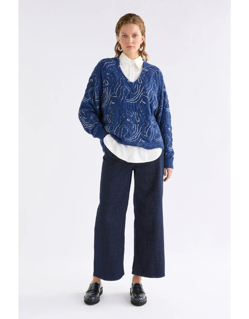 Elk Otillia sweater in blue and silver, featuring a cozy knit texture and relaxed fit, displayed on a neutral background.