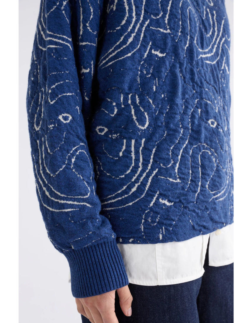 Elk Otillia sweater in blue and silver, featuring a cozy knit design and ribbed cuffs, displayed on a neutral background.
