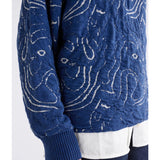 Elk Otillia sweater in blue and silver, featuring a cozy knit design and ribbed cuffs, displayed on a neutral background.